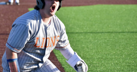 Danner Philbrick gives a yell after a leadoff single and error in the seventh inning. Ben Ray / The Reporter