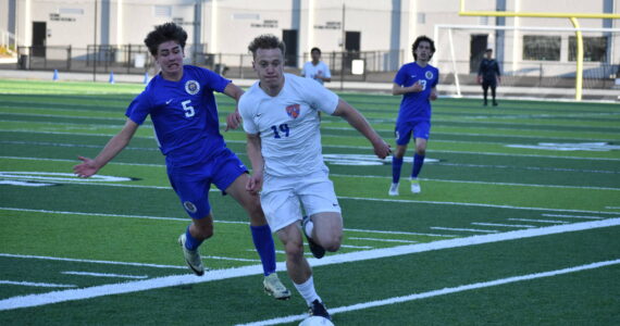 Davyd Fedina chases down the ball at Federal Way Memorial Field against Stadium. Ben Ray / The Reporter