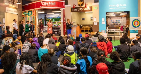 Auburn Mayor Nancy Backus addresses students gathered to celebrate and cut the ribbon on Junior Achievement’s new Auburn City Hall storefront at JA Biztown on Perimeter Road in Auburn. Photo courtesy of Junior Achievement