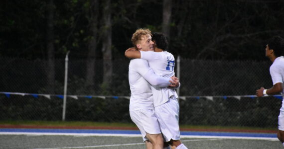Davyd Fedina and Benji Toscano celebrate the Lions’ third goal of the night. Ben Ray / The Reporter