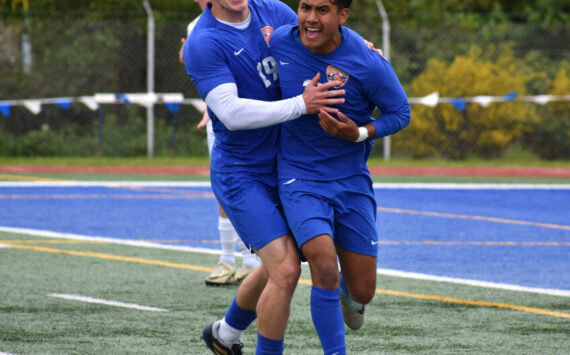 Davyd Fedina and Benji Toscano celebrate after taking the lead in the second half over Bainbridge. Ben Ray / The Reporter
