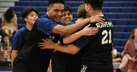 A pod of Ravens gives some smiles during senior night. Ben Ray / The Reporter