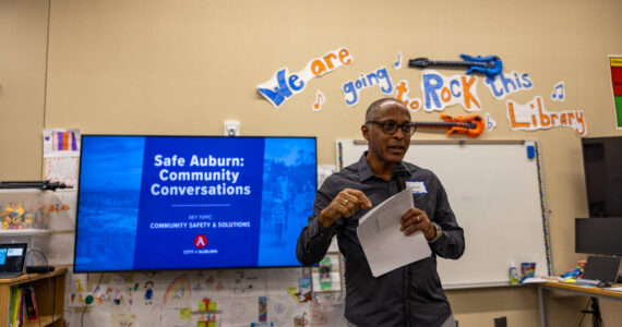 Master of ceremonies Grantley Martelly leads off the public safety meeting at Chinook Elementary. Photo courtesy of City of Auburn