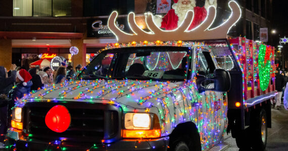 A truck tricked out with the bright, cheerful lights of the Christmas season.