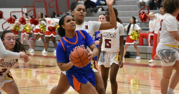 Kyra Thomas makes a layup against Thomas Jefferson. Photos by Ben Ray / The Reporter