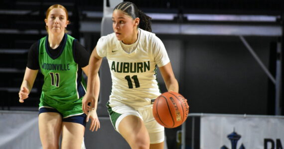 Auburn’s Kaleesa Howard dribbles the ball up the floor for the Trojans. Ben Ray / The Reporter