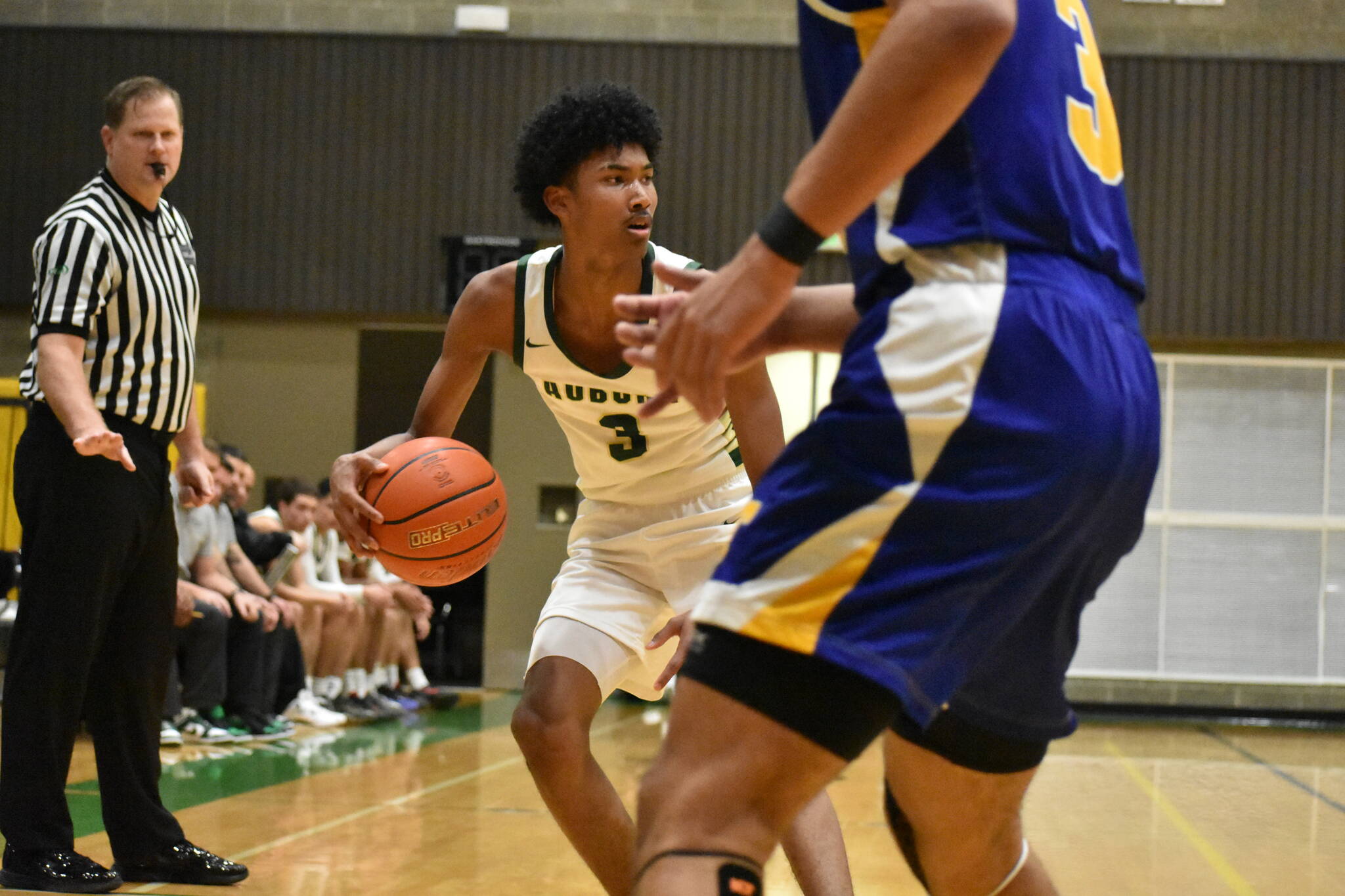 Daniel Johnson eyes a teammates for the Trojans. Ben Ray / The Reporter