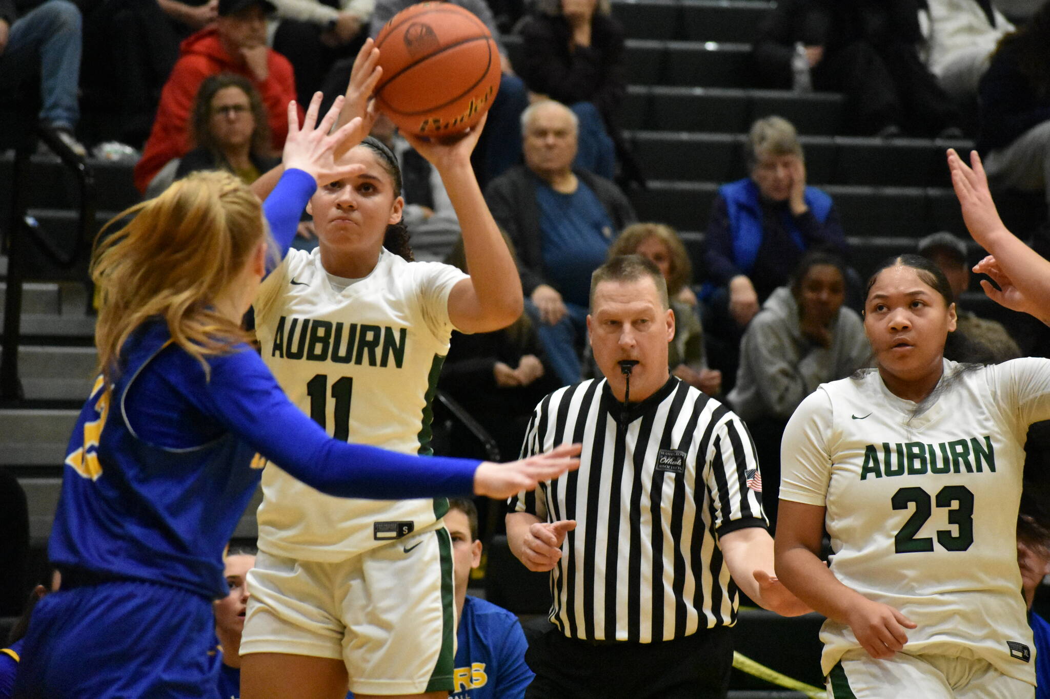 Kaleesa Howard take a three point shot against Tahoma. Ben Ray / The Reporter