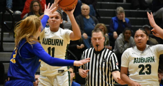 Kaleesa Howard take a three point shot against Tahoma. Ben Ray / The Reporter