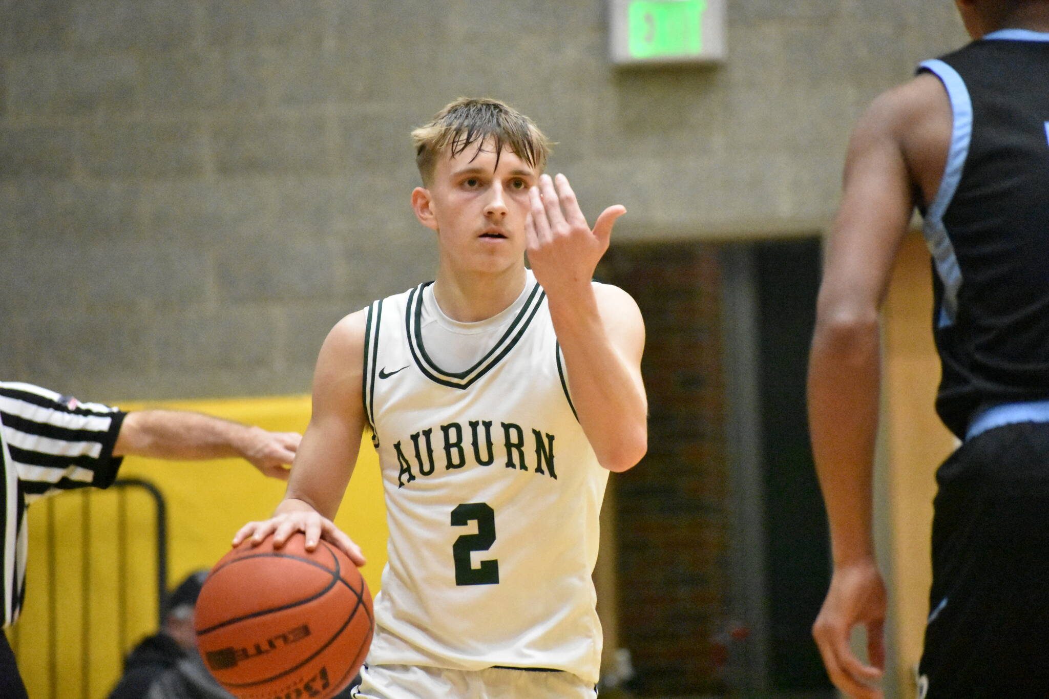 Auubrn’s Carter Hansen waves up a teammate. Ben Ray / The Reporter