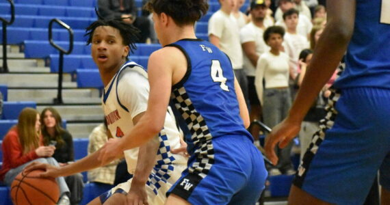 Auburn Mountainview senior Sebastian Arius backs down a Federal Way player. Ben Ray / The Reporter