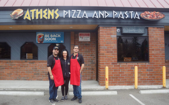 Pictured left to right: Bill, Nina and Tom Contoravdis, co-owners of Athens Pizza and Pasta, pose for a photo in front of their restaurant. File photo