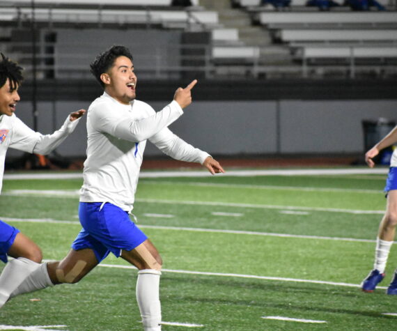 Benji Toscano celebrates his goal against Kent-Meridian. Ben Ray / The Reporter