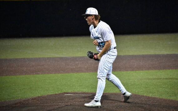 Cameron Bain lets a yell after ending the game against Kentwood. Ben Ray / The Reporter