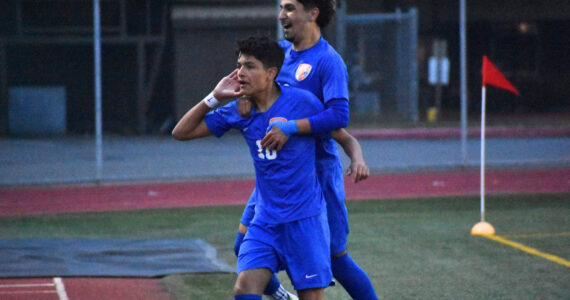 Sergio Mercado leaps on the shoulders of Pablo Montiel after he scores his first goal of the night. Ben Ray / The Reporter