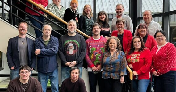 A group photo from Dec. 2024 of Sound Publishing’s King County news team that produces local newspapers including the Auburn Reporter. File photo