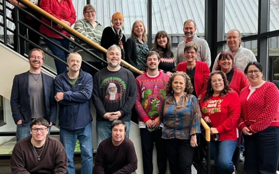 A group photo from Dec. 2024 of Sound Publishing’s King County news team that produces local newspapers including the Auburn Reporter. File photo