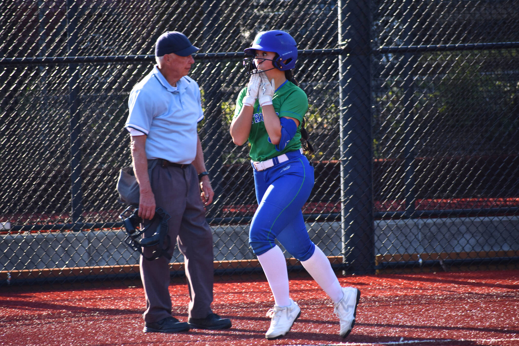 Liberty’s Emi Connell approaches home plate with a smile. Ben Ray / The Reporter