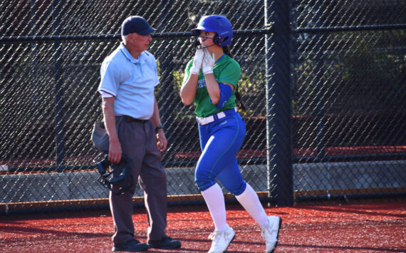 Liberty’s Emi Connell approaches home plate with a smile. Ben Ray / The Reporter