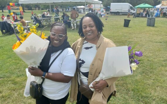 Exa McClain and Marie Mitchell celebrate the Juneteenth celebration at Auburn’s Les Gove Park on June 22 as an expression of unity between all people. Photo by Robert Whale/Auburn Reporter