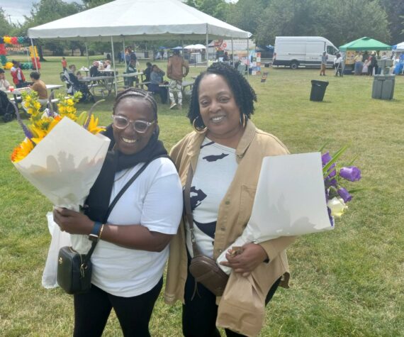 Exa McClain and Marie Mitchell celebrate the Juneteenth celebration at Auburn’s Les Gove Park on June 22 as an expression of unity between all people. Photo by Robert Whale/Auburn Reporter