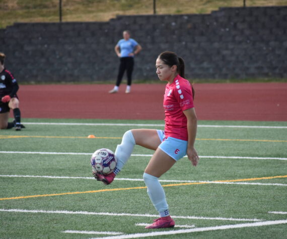 Kailalani Ahuna takes a touch during pre-game warm-ups. Ben Ray / The Reporter