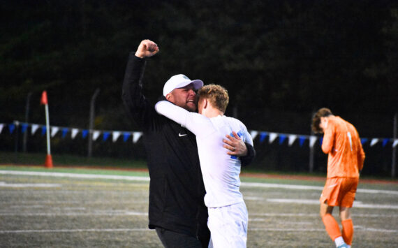 Manager Joey West and Fedina celebrate the 3-2 win over Shorewood. Ben Ray / The Reporter