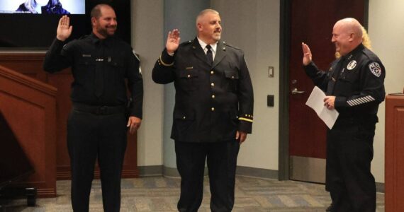 Auburn Police Chief Mark Caillier, right, administers the Oath of Honor to (from left) Sgt. Nate Fry and Patrol Commander Jason Blake. Photo courtesy of the Auburn Police Department