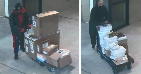 Jason Dean Warter’s accomplice and Warter in the black sweatshirt stealing electronics from the storage unit. Screenshot from charging documents