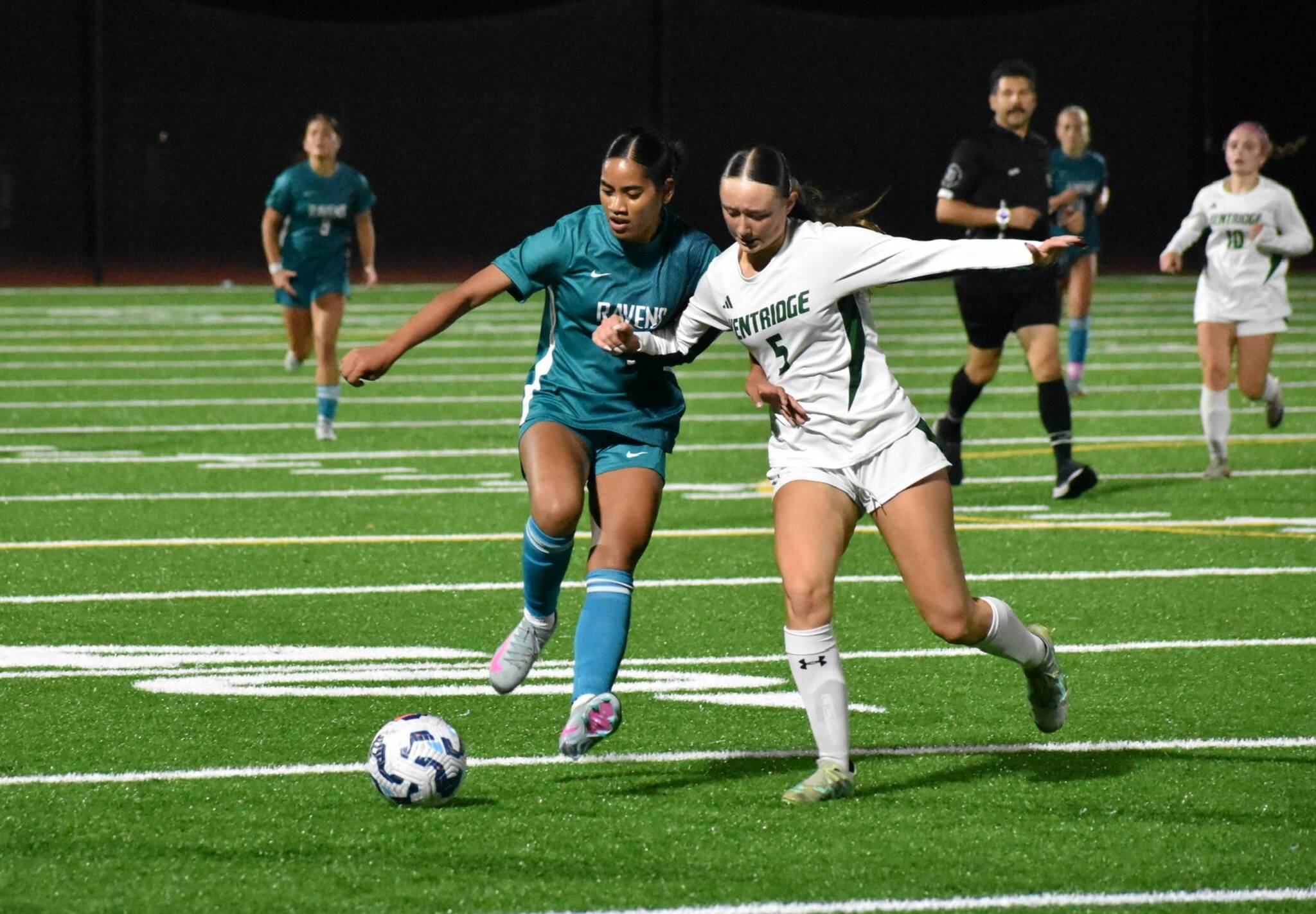 Destiney Lanki fights off a Kentridge defender. Photos by Ben Ray / The Reporter