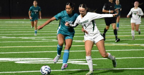 Destiney Lanki fights off a Kentridge defender. Ben Ray / The Reporter