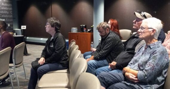 People in the audience pay attention to what city leaders are saying Sept. 30. Photo by Robert Whale/Auburn Reporter