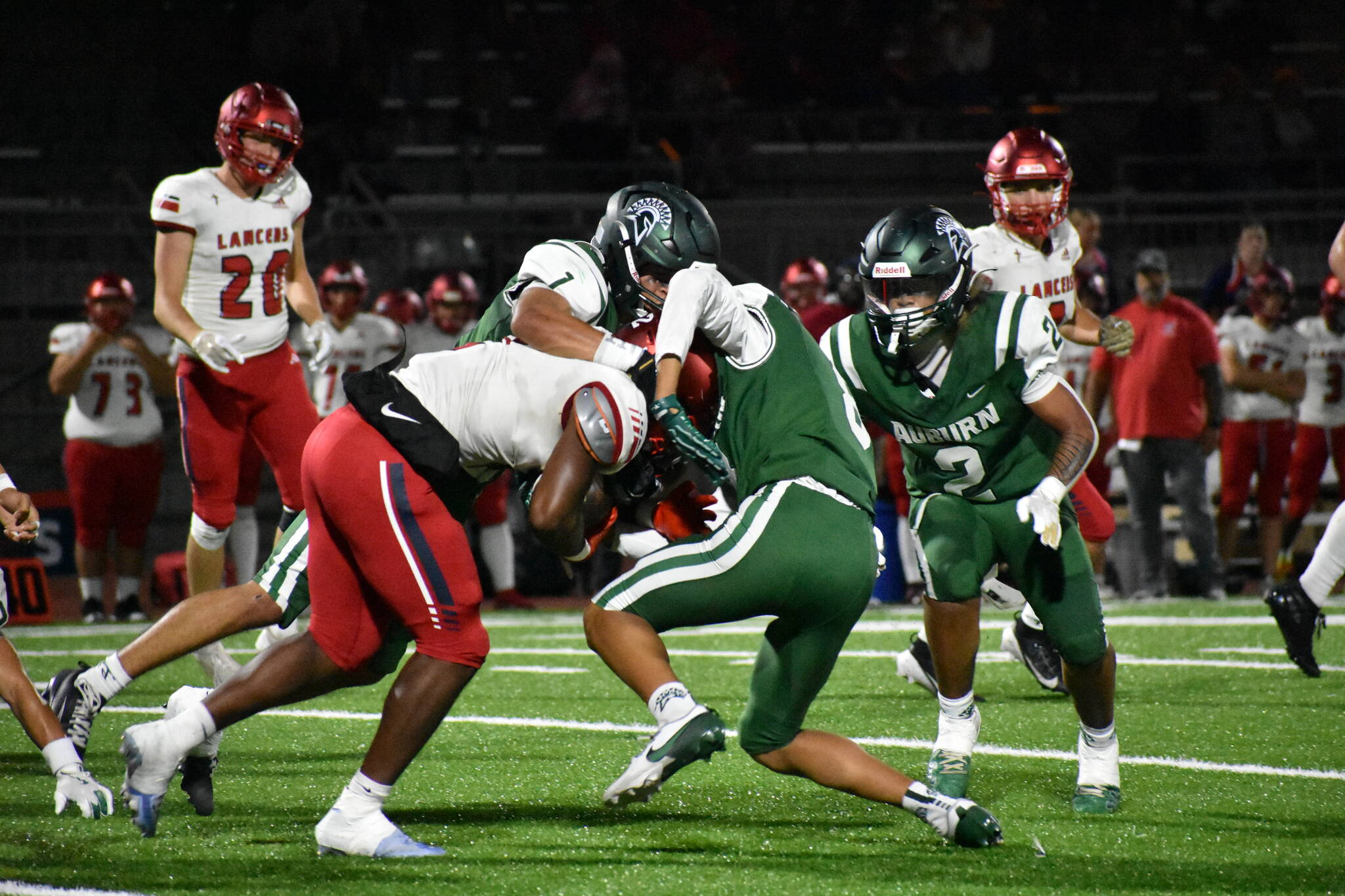 A pair of Auburn defenders tackle a Kennedy Catholic running back. Ben Ray / The Reporter
