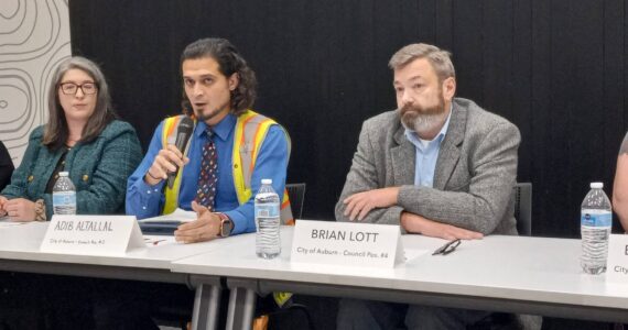 From left to right, Position 2 Auburn City Councilmember Kate Baldwin and challenger Adib Altallal, and Brian Lott, candidate for Position 4, take turns answering questions at the Auburn Area Chamber of Commerce and Junior Achievement Candidate Forum. Photo by Robert Whale/Auburn Reporter