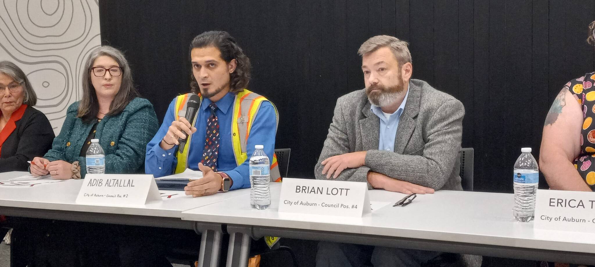 From left to right, Position 2 Auburn City Councilmember Kate Baldwin and challenger Adib Altallal, and Brian Lott, candidate for Position 4, take turns answering questions at the Auburn Area Chamber of Commerce and Junior Achievement Candidate Forum. Photo by Robert Whale/Auburn Reporter