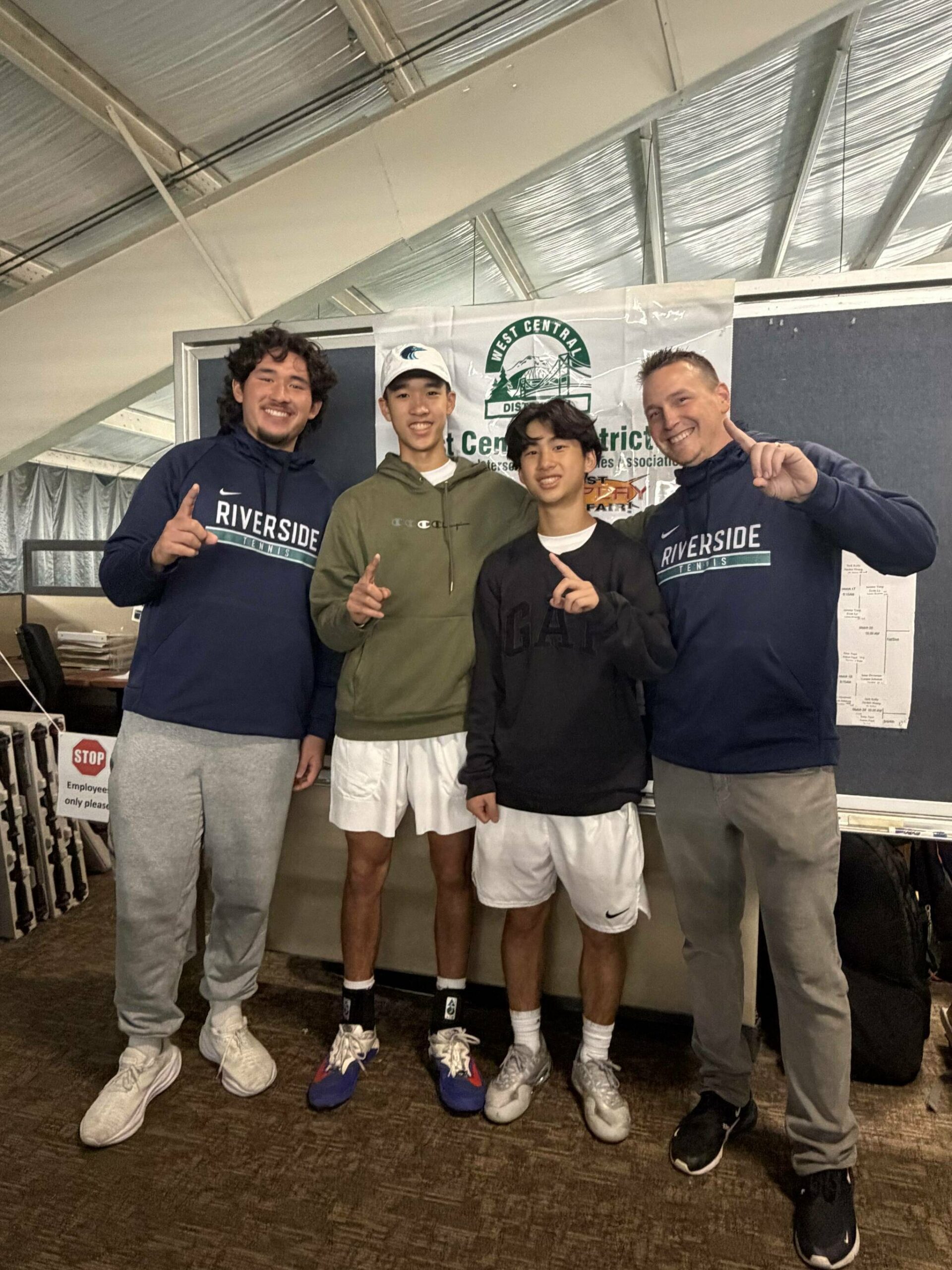 Auburn Riverside celebrates 4A West Central District doubles championship. Photos by Nathan Hyun