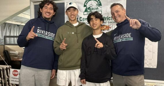 Auburn Riverside celebrates 4A West Central District doubles championship. Photo by Nathan Hyun
