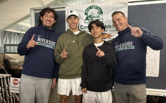 Auburn Riverside celebrates 4A West Central District doubles championship. Photo by Nathan Hyun