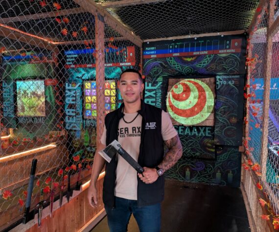Owner Vance Olsen shows off one of Sea Axe’s throwing axes. Photo by Bailey Jo Josie/Sound Publishing