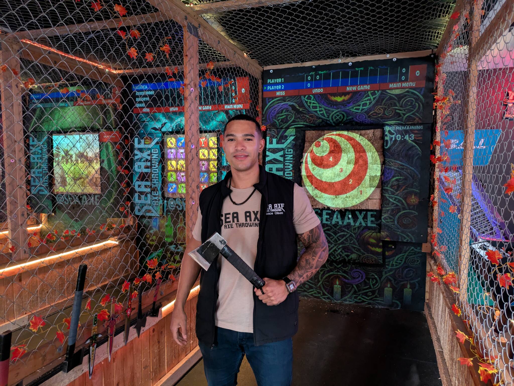 Owner Vance Olsen shows off one of Sea Axes throwing axes. Photos by Bailey Jo Josie/Sound Publishing