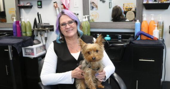Third Dimension Salon owner Deana McFarlane and salon “director of cuddles” Bodhi. Third Dimension has won its third Best of Auburn award. Photo by Bailey Jo Josie/Sound Publishing