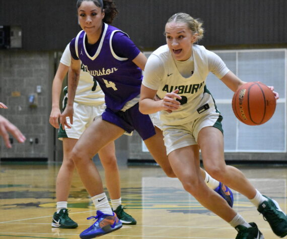 Avery Hansen drives to the basket against North Thurston. Ben Ray / The Reporter