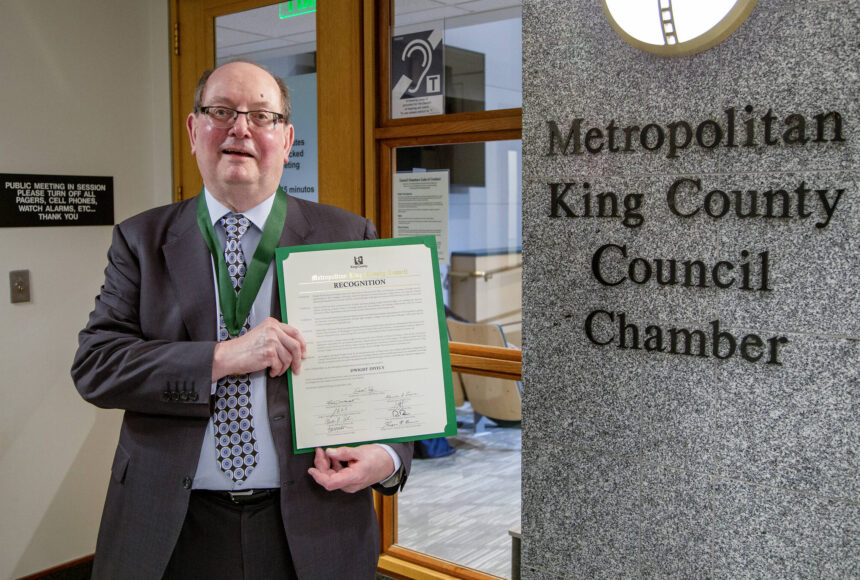 <p>Dwight Dively poses with the proclamation and the MLK Medal of Distinguished Service. Photo courtesy of King County</p>