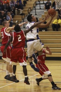 Auburn Mountainview senior Michael Patenaude powers to the bucket against Franklin Pierce.
