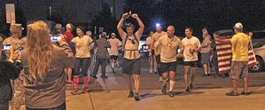 Supporters cheer on members of the Always Brothers Marine running crew as they pass through Auburn on the Interurban Trail early Sunday morning.