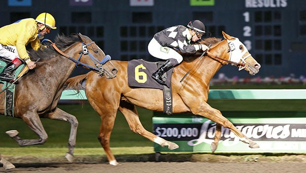 Liberty Lake and leading rider Julien Couton hold off Lizzy Lass for a half-length victory in Friday's feature race for older fillies and mares.