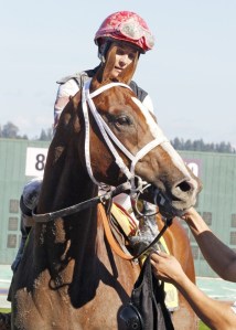Chantal Sutherland-Kruse is all smiles after riding He's Not Bluffin to victory in the $50