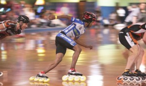 Eben Jackson glides around the track during an inline speed skating competition.