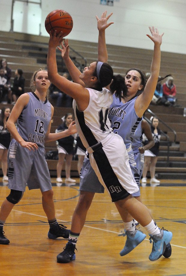 Auburn Riverside's Olivia Denton goes for the shot against Mount Rainier. Denton had eight points in the game.
