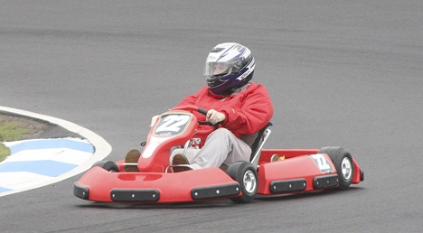 Kris Hill from the Covington Reporter puts a go-kart through it's paces at the brand new Pacific Grand Prix course at Pacific Raceways.